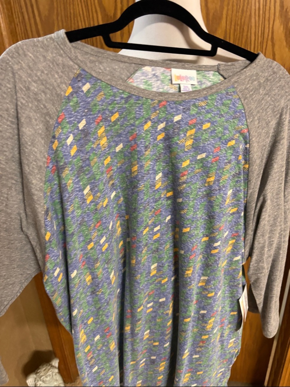 LuLaRoe Heather Gray Raglan Top with Blue Floral Pattern